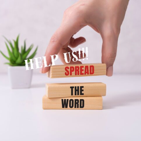 A hand stacking wooden blocks with the words "SPREAD" and "THE WORD." The text "HELP US!!!" appears in white over the image. A small potted plant is in the background.